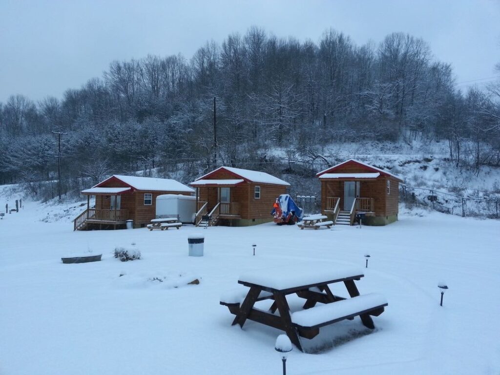 Real McCoy Cabins Cabins covered in snow