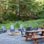 a group of chairs around a fire pit