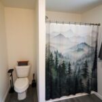 a bathroom with a shower curtain