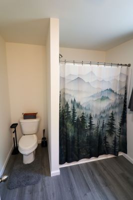 a bathroom with a shower curtain