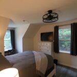 a bedroom with a bed and a dresser