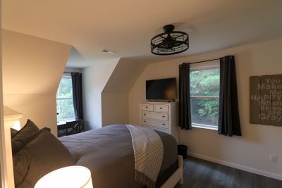 a bedroom with a bed and a dresser